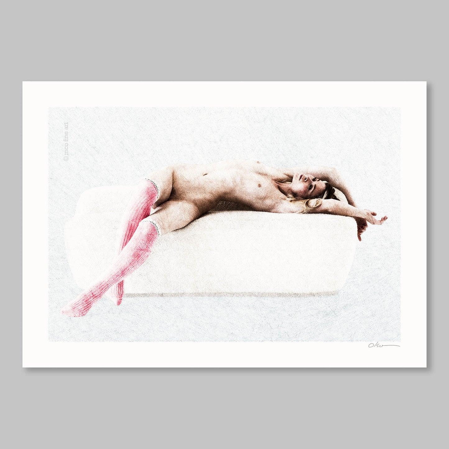 Naked person lying on a white surface with pink socks, framed against a gray background