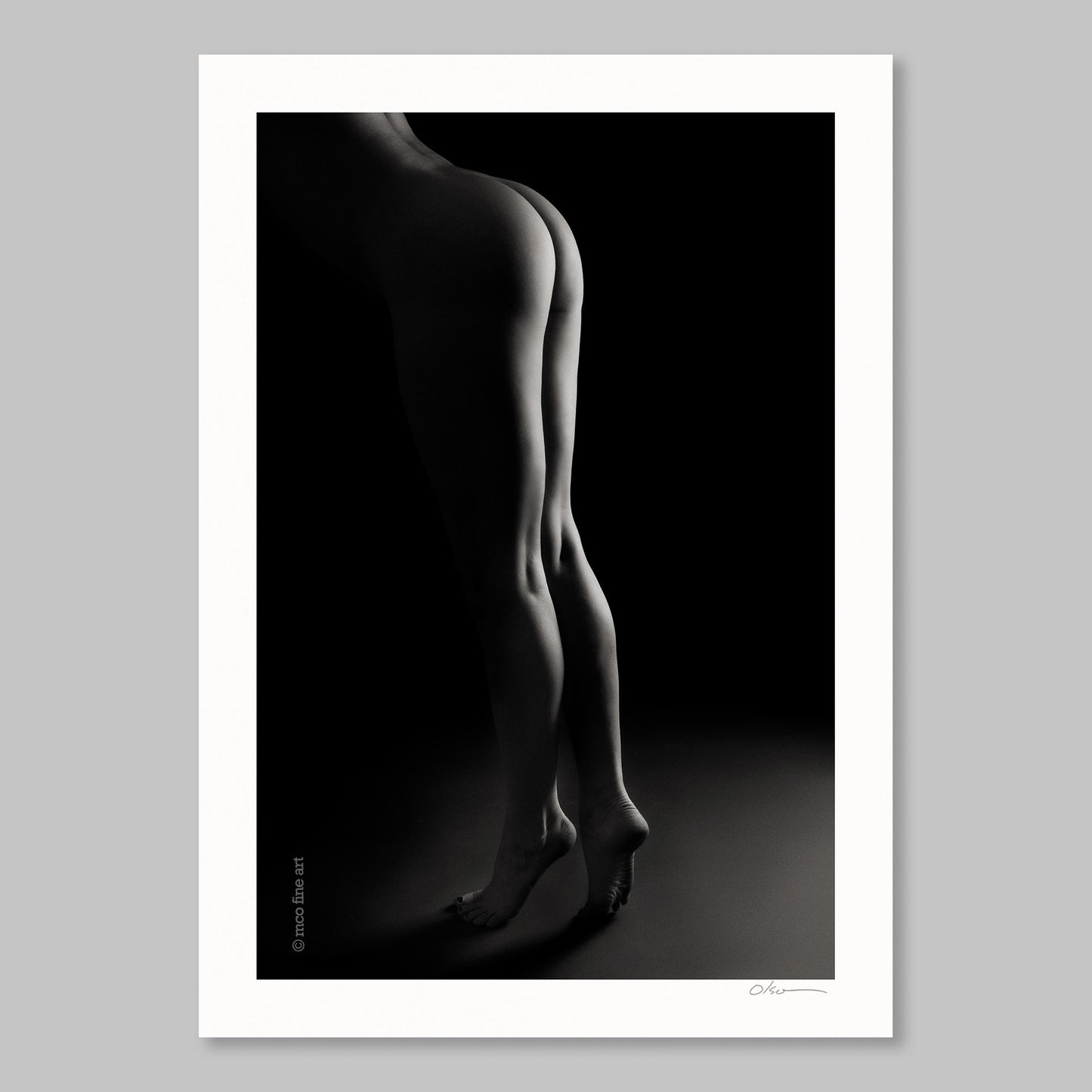 Black and white silhouette art print of a woman's legs against a dark background
