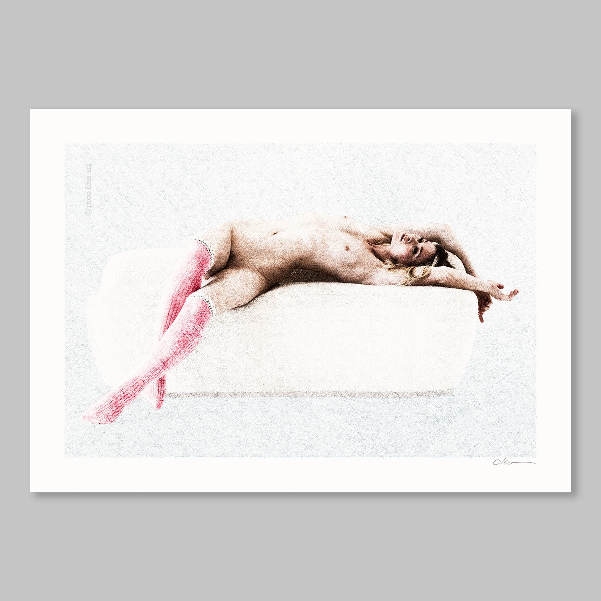 Naked person lying on a white surface with pink socks, framed against a gray background