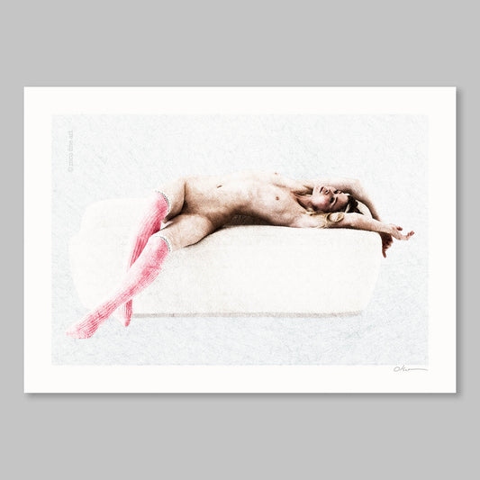 Naked person lying on a white surface with pink socks, framed against a gray background