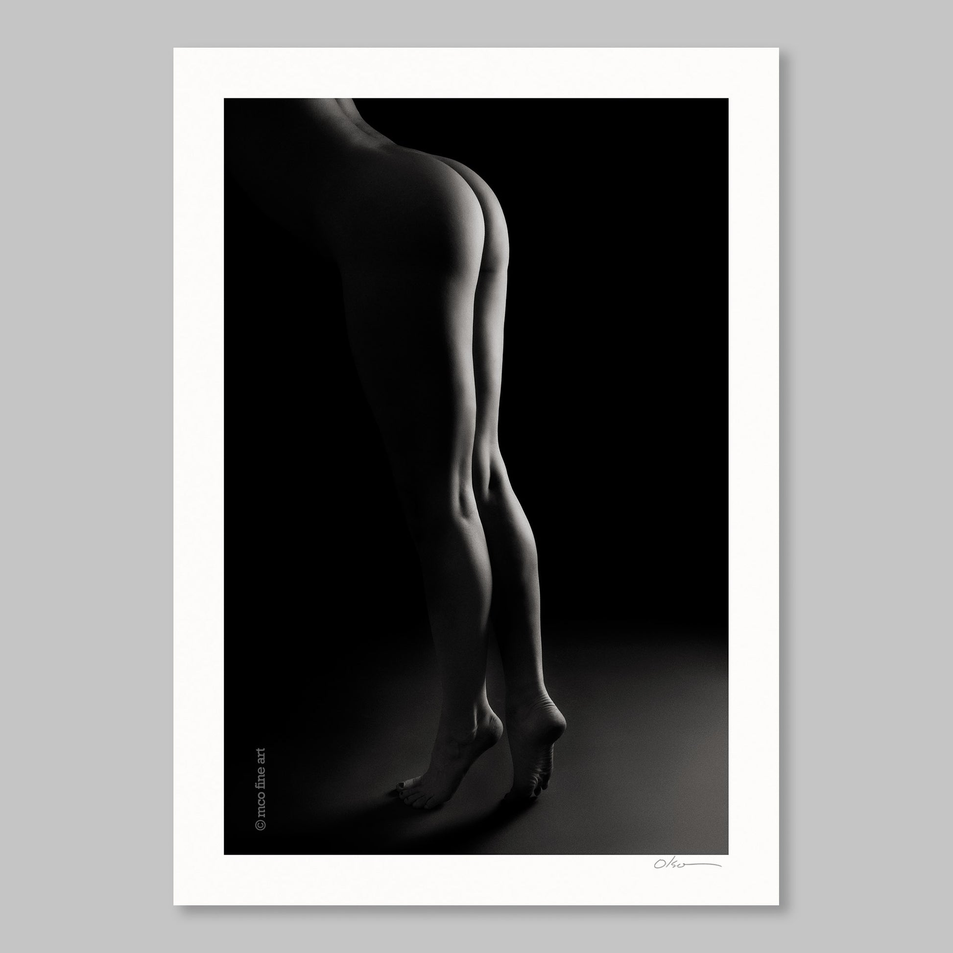 Black and white silhouette art print of a woman's legs against a dark background