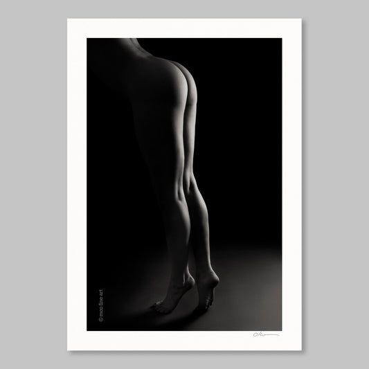 Black and white silhouette art print of a woman's legs against a dark background